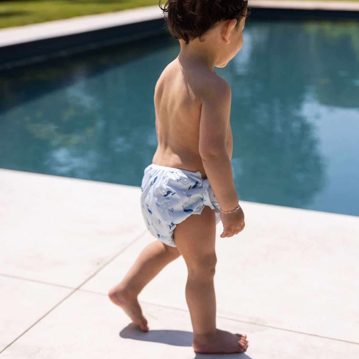 child wearing swim diapers