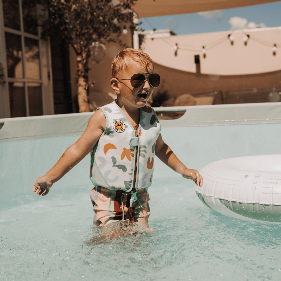 child wearing a float vest